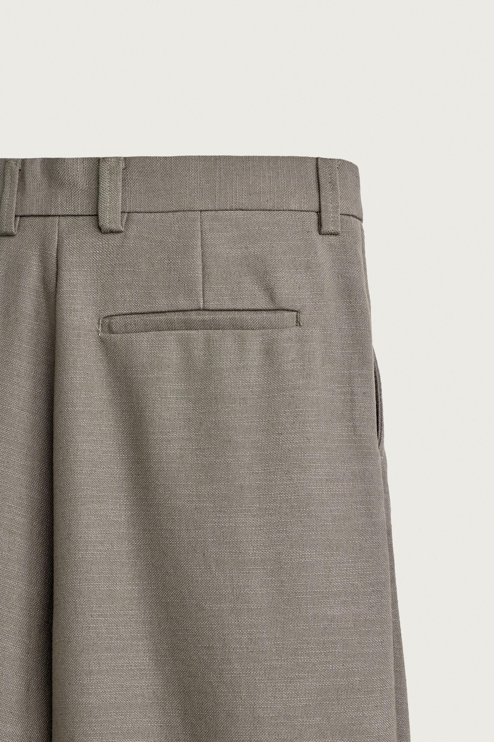 RELAXED FIT STRUCTURED PLEATED PANTS